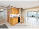 Traditional kitchen with cabinetry, checkered tile flooring, and an adjoining lake view living room at 2818 Cherry Ln, Denver, NC 28037