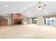 Spacious living room featuring a large brick fireplace and lake views at 2818 Cherry Ln, Denver, NC 28037