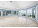 Bright living room with lake views, fan lights, and tile flooring at 2818 Cherry Ln, Denver, NC 28037