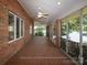 Covered porch with ceiling fans and lake views at 2818 Cherry Ln, Denver, NC 28037