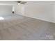 Carpeted Living room with bright natural light and ample open space at 3143 Windbluff Dr, Charlotte, NC 28277