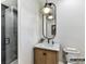 Stylish bathroom featuring a modern vanity, sleek lighting, and a walk-in shower with gray tile at 4015 Pritchard Pl, Fort Mill, SC 29715