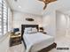 Comfortable bedroom with a stylish headboard, end tables, and a ceiling fan at 4015 Pritchard Pl, Fort Mill, SC 29715