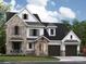 Charming two-story home with stone accents, a well-maintained lawn, and a three-car garage at 4015 Pritchard Pl, Fort Mill, SC 29715