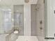 Elegant shower featuring gray vertical tiles, mosaic accents, and premium fixtures for a spa-like experience at 4015 Pritchard Pl, Fort Mill, SC 29715
