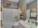 Well-lit bathroom featuring a white vanity, toilet, and tub/shower combo with neutral wall color at 433 Linsbury Ct, Gastonia, NC 28056