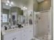 Bright bathroom with double vanity, glass shower, and neutral color scheme at 433 Linsbury Ct, Gastonia, NC 28056