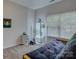Cozy bedroom with futon, vertical hydroponic system, and natural light from a large window at 433 Linsbury Ct, Gastonia, NC 28056