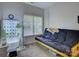 Bedroom featuring a futon with a hydroponic system beside a window that provides natural light at 433 Linsbury Ct, Gastonia, NC 28056