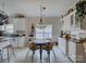 Bright breakfast nook with a decorative light fixture and ample storage, ideal for casual dining at 433 Linsbury Ct, Gastonia, NC 28056