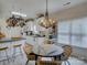 Cozy breakfast nook with a unique chandelier and natural light, creating an inviting dining space at 433 Linsbury Ct, Gastonia, NC 28056