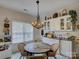Bright breakfast nook featuring a modern chandelier, comfortable seating, and ample natural light at 433 Linsbury Ct, Gastonia, NC 28056