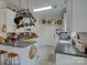 Bright kitchen featuring white cabinets, modern countertops, and hanging pot rack at 433 Linsbury Ct, Gastonia, NC 28056