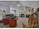 Bright living room with a fireplace, vaulted ceilings, comfortable seating, and open floor plan to the kitchen at 433 Linsbury Ct, Gastonia, NC 28056