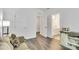 Bright living area showcasing neutral sofa, modern decor, and hallway views to bathroom and other rooms at 5112 Larewood Dr, Charlotte, NC 28215