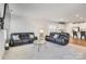 Bright and open living room with carpet, two sofas, and views of the kitchen at 5112 Larewood Dr, Charlotte, NC 28215