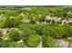 A neighborhood from above with tree-lined streets and various rooftops at 540 Garrison Sw Ct, Concord, NC 28025