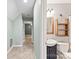 Bathroom with a vessel sink, a rustic mirror and shelving, and modern fixtures at 540 Garrison Sw Ct, Concord, NC 28025