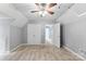 Bedroom with neutral walls, a ceiling fan, closet and carpeted floor at 540 Garrison Sw Ct, Concord, NC 28025