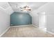 Spacious bedroom with neutral walls, a ceiling fan, large window, and carpeted floor at 540 Garrison Sw Ct, Concord, NC 28025