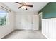 Bedroom featuring plush carpet, closets, and a dark green accent wall at 540 Garrison Sw Ct, Concord, NC 28025