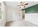Bedroom featuring plush carpet, closets, and a dark green accent wall at 540 Garrison Sw Ct, Concord, NC 28025