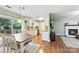 Dining room with hardwood floors, an open layout, and natural light at 540 Garrison Sw Ct, Concord, NC 28025