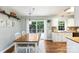 Dining room with sliding glass doors to the deck and an open sightline to the kitchen at 540 Garrison Sw Ct, Concord, NC 28025