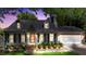 Charming home exterior with a well-manicured lawn and illuminated landscape lighting at 540 Garrison Sw Ct, Concord, NC 28025