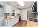 Modern kitchen with sleek black appliances, wood countertops, white cabinets and tiled backsplash at 540 Garrison Sw Ct, Concord, NC 28025