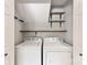 Functional laundry area with side by side washer and dryer and convenient built-in shelving at 540 Garrison Sw Ct, Concord, NC 28025