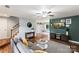 Open-concept living room with hardwood floors and an open sightline to the dining area at 540 Garrison Sw Ct, Concord, NC 28025