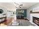 Bright living room featuring a fireplace, hardwood floors, and an open layout at 540 Garrison Sw Ct, Concord, NC 28025