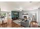 Cozy living room with hardwood floors, fireplace, and an open floor plan at 540 Garrison Sw Ct, Concord, NC 28025