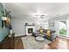 Well-lit living room with a white brick fireplace and comfortable gray sectional at 540 Garrison Sw Ct, Concord, NC 28025