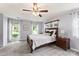 Well-lit main bedroom features plush carpet, a ceiling fan and is filled with natural light at 540 Garrison Sw Ct, Concord, NC 28025