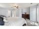 Cozy main bedroom with soft carpet, ceiling fan, and dresser storage at 540 Garrison Sw Ct, Concord, NC 28025