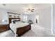 Spacious main bedroom with plush carpeting, bright windows and an open doorway to walk-in closet at 540 Garrison Sw Ct, Concord, NC 28025