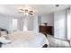 Cozy main bedroom with soft carpet, ceiling fan, and dresser storage at 540 Garrison Sw Ct, Concord, NC 28025