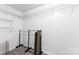 White walk-in closet featuring wire shelving and hanging rack system at 540 Garrison Sw Ct, Concord, NC 28025