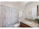 Cozy bathroom features granite countertop, patterned shower curtain, and functional layout at 5422 Shannon Bell Ln, Charlotte, NC 28277
