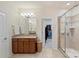 Bathroom with granite vanity, shower, and view to walk-in closet at 5422 Shannon Bell Ln, Charlotte, NC 28277