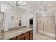 Bright bathroom with granite counters, walk-in shower, and walk-in closet at 5422 Shannon Bell Ln, Charlotte, NC 28277