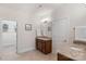Bathroom featuring double granite sink, cabinets, and tile flooring at 5422 Shannon Bell Ln, Charlotte, NC 28277