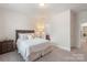 Bedroom with neutral walls, carpet, and access to ensuite bathroom at 5422 Shannon Bell Ln, Charlotte, NC 28277