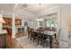 Open-concept dining area connecting to a modern kitchen and inviting living room space at 5422 Shannon Bell Ln, Charlotte, NC 28277
