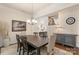Elegant dining room featuring a wooden table, stylish chandelier, and staircase view at 5422 Shannon Bell Ln, Charlotte, NC 28277