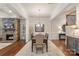 Spacious dining area with wood floors, chandelier, and stone fireplace in adjacent room at 5422 Shannon Bell Ln, Charlotte, NC 28277