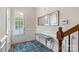 Welcoming entryway with a mirror, console table, hardwood floors, and natural light at 5422 Shannon Bell Ln, Charlotte, NC 28277