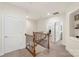 Upstairs hallway with carpet floors and spindle railing staircase at 5422 Shannon Bell Ln, Charlotte, NC 28277